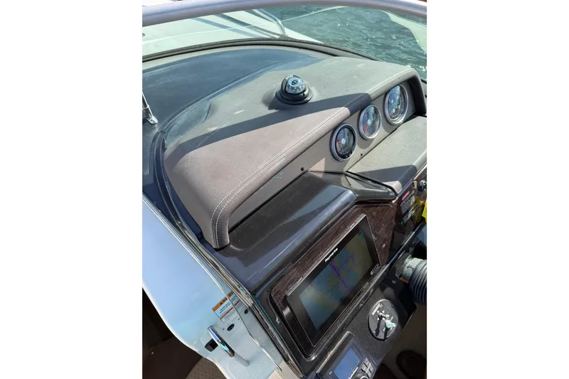 Slide: The Image of Dashboard of a 2018 Sea Ray Sundancer 260 boat with navigation instruments. - 23