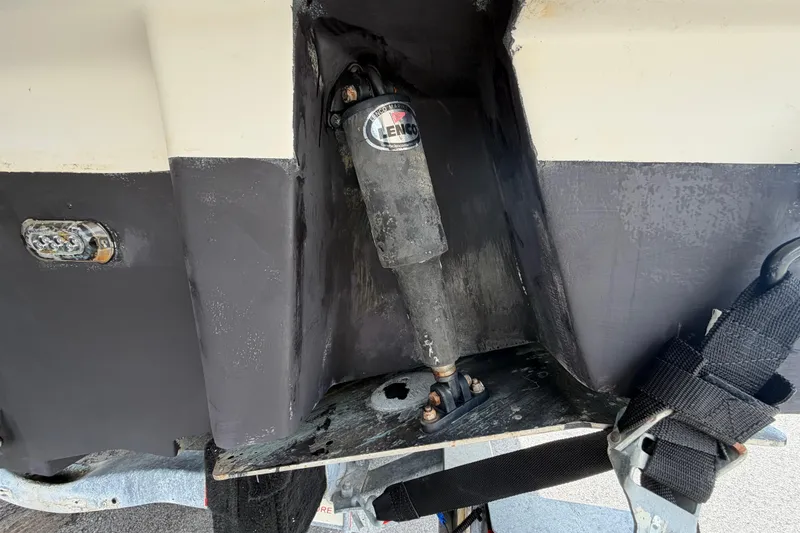 Slide: The Image of Close-up of 2018 Sea Ray Sundancer 260 boat's trim tab and actuator. - 6