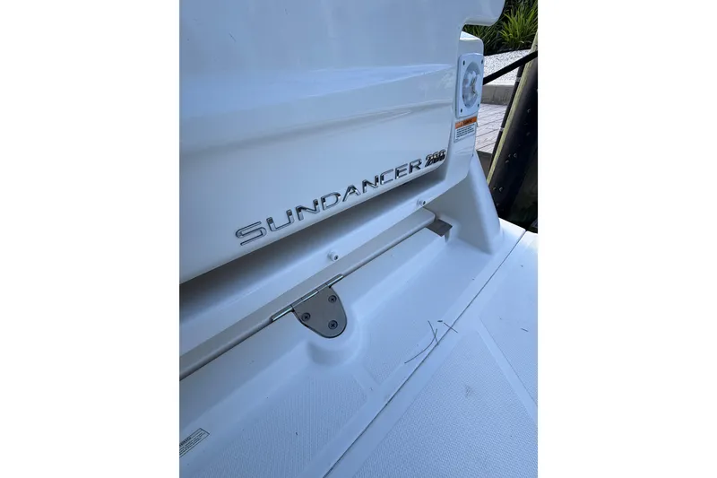 Slide: The Image of 2018 Sea Ray Sundancer 260 boat emblem on white surface. - 39