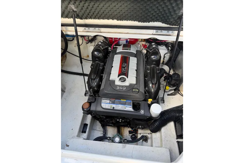 Slide: The Image of Engine compartment of a 2018 Sea Ray Sundancer 260 boat, featuring a 6.2L engine. - 48