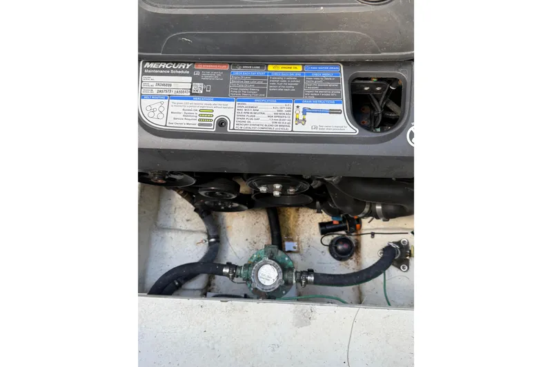 Slide: The Image of Engine compartment of a 2018 Sea Ray Sundancer 260 with Mercury maintenance schedule. - 49