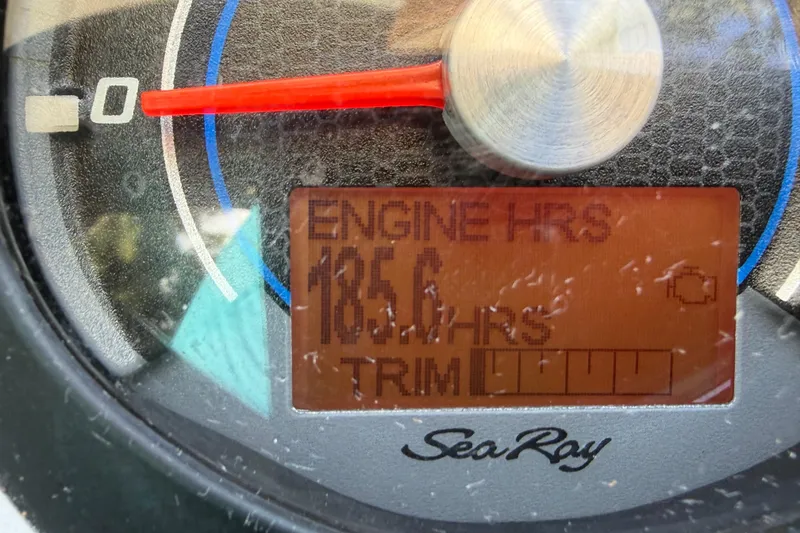 Slide: The Image of Close-up of Sea Ray Sundancer 260 engine hour meter displaying 185.6 hours. - 52