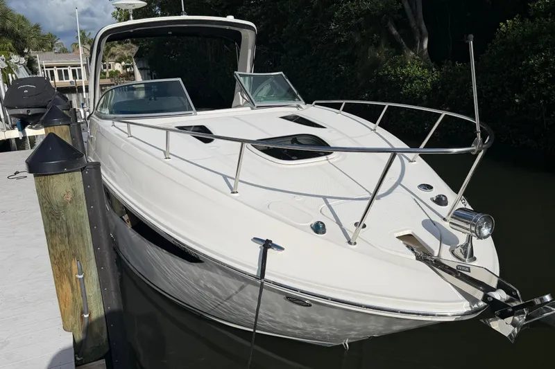 Slide: The Image of 2018 Sea Ray Sundancer 260 docked, showcasing sleek design and modern features. - 63