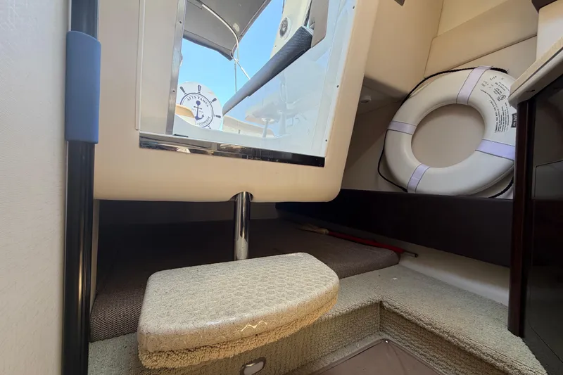 Slide: The Image of Interior of 2018 Sea Ray Sundancer 260 boat with life preserver and steps. - 67