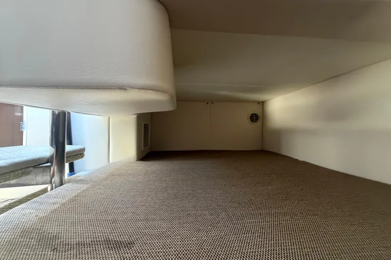 Slide: The Image of Interior cabin view of 2018 Sea Ray Sundancer 260 boat, featuring seating and carpeted flooring. - 70