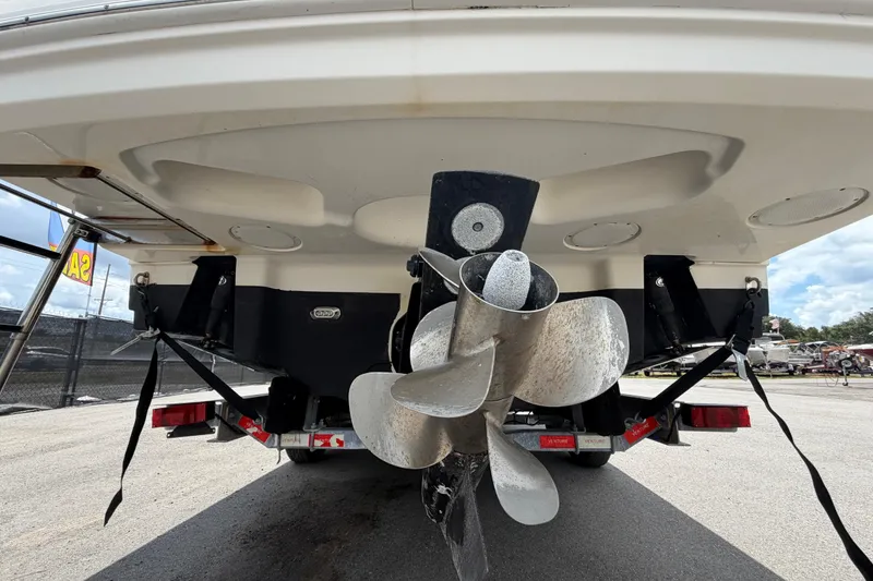 Slide: The Image of 2018 Sea Ray Sundancer 260 boat propeller and stern view on trailer. - 4