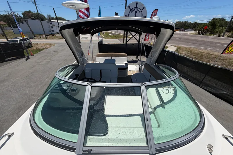 Slide: The Image of 2018 Sea Ray Sundancer 260 boat with sleek design and spacious cockpit area. - 76