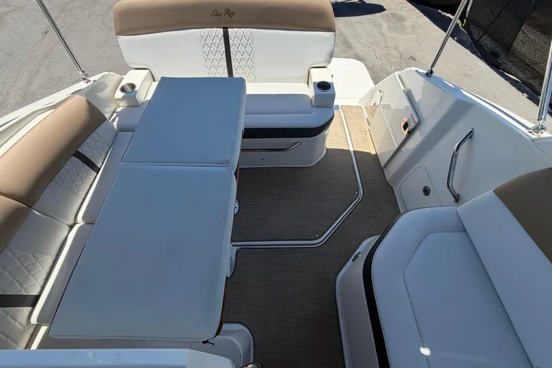 Slide: The Image of 2018 Sea Ray Sundancer 260 boat interior with beige seating and table. - 80