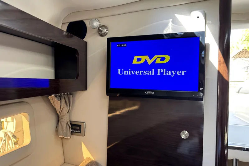 Slide: The Image of Interior of 2018 Sea Ray Sundancer 260 with DVD player and modern design elements. - 8