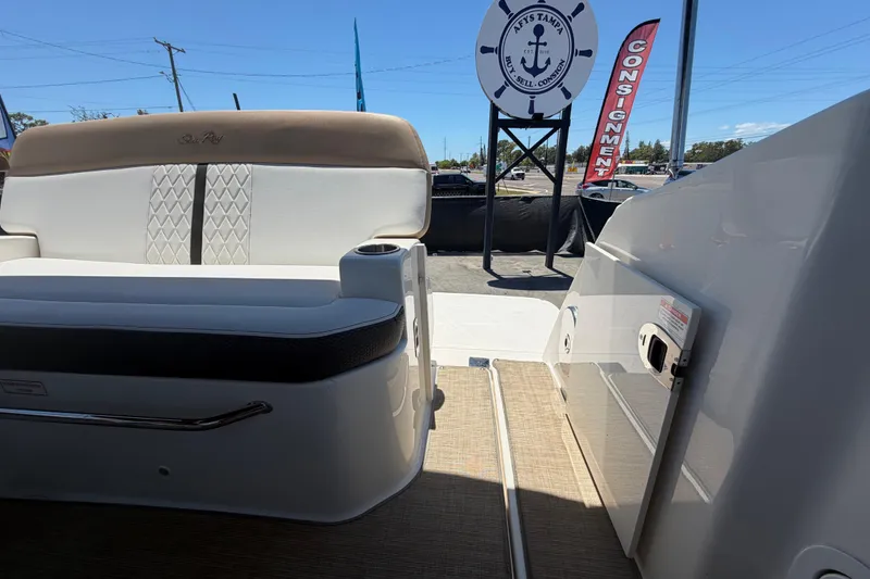 Slide: The Image of 2018 Sea Ray Sundancer 260 boat interior with seating and open deck view. - 91