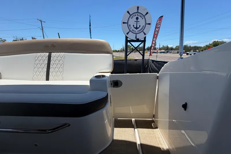 Slide: The Image of 2018 Sea Ray Sundancer 260 boat interior with seating and nautical decor. - 92