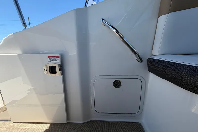 Slide: The Image of 2018 Sea Ray Sundancer 260 interior detail with seating and storage compartment. - 93