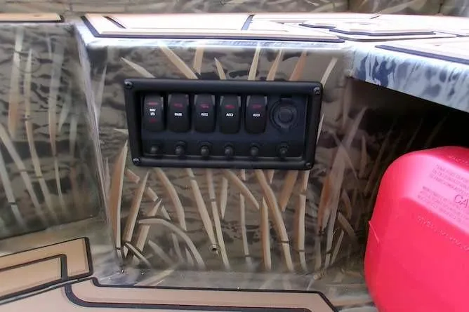 Slide: The Image of Control panel on 2026 Tracker Grizzly 1650 T Prairie Wings Edition boat interior. - 8