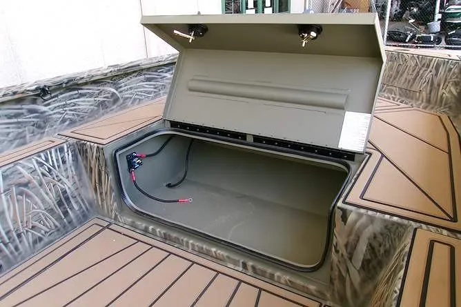 Slide: The Image of 2026 Tracker Grizzly 1650 T Prairie Wings Edition boat storage compartment, open and spacious. - 7