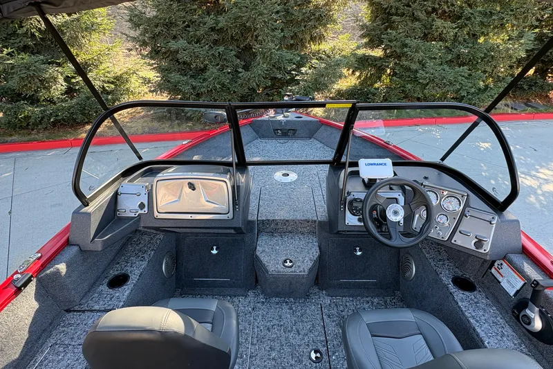 Slide: The Image of 2026 Tracker Pro Guide V-175 WT boat interior with steering console and seating. - 19
