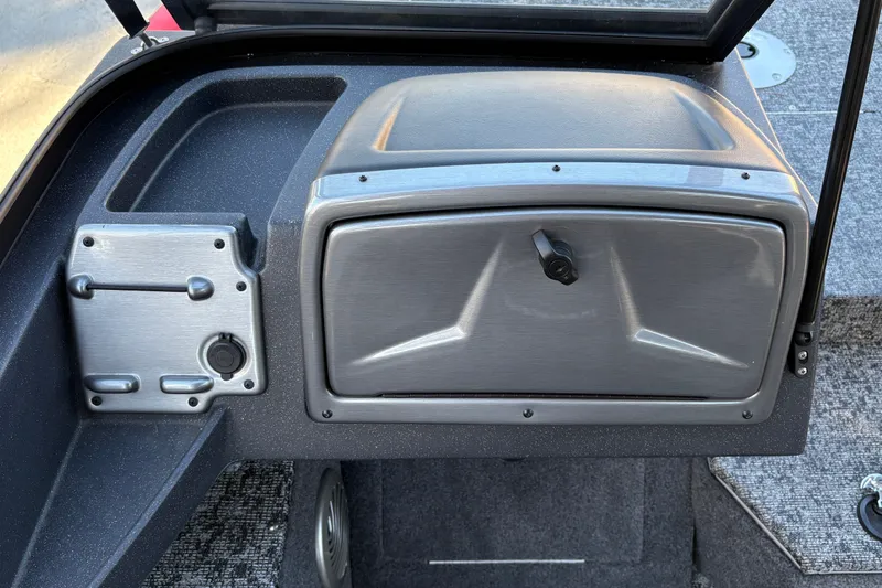 Slide: The Image of 2026 Tracker Pro Guide V-175 WT dashboard with storage compartment and control panel. - 25