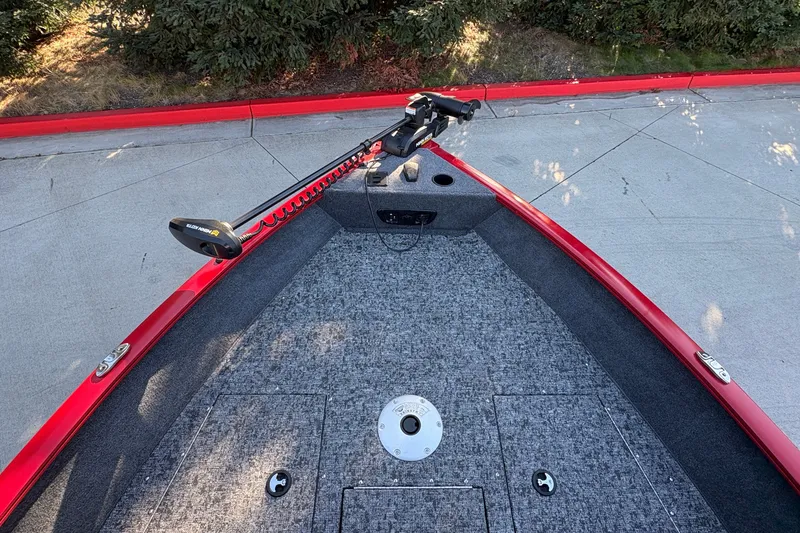 Slide: The Image of 2026 Tracker Pro Guide V-175 WT boat with red trim and carpeted deck. - 15