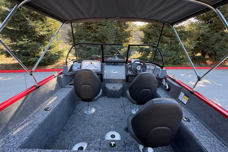 Slide: The Image of Interior view of 2026 Tracker Pro Guide V-175 WT boat with seating and controls. - 20