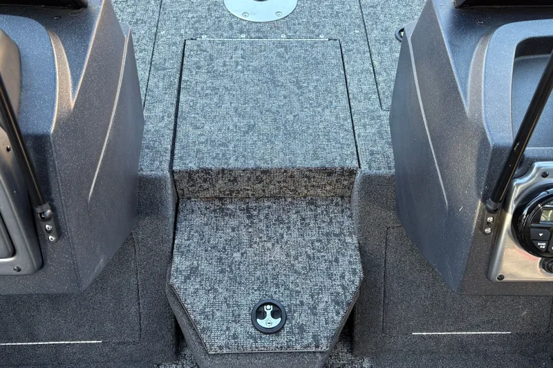 Slide: The Image of 2026 Tracker Pro Guide V-175 WT boat interior with carpeted flooring and storage compartment. - 33