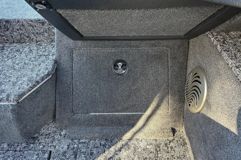 Slide: The Image of 2026 Tracker Pro Guide V-175 WT boat interior with carpeted storage compartment. - 30