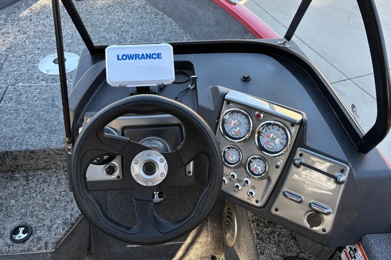 Slide: The Image of 2026 Tracker Pro Guide V-175 WT boat dashboard with steering wheel and Lowrance GPS. - 22