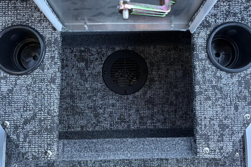 Slide: The Image of Interior of 2026 Tracker Pro Guide V-175 WT boat with cup holders and carpeted flooring. - 41