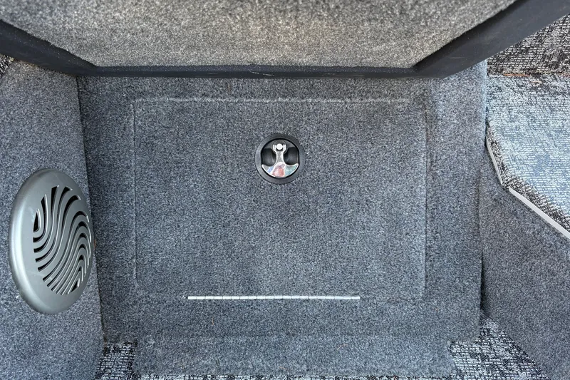 Slide: The Image of Carpeted interior of 2026 Tracker Pro Guide V-175 WT boat with speaker detail. - 31