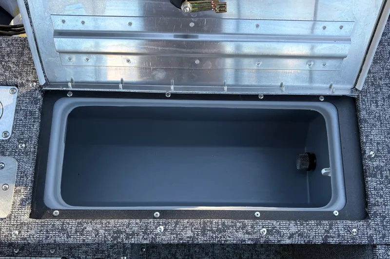 Slide: The Image of Open storage compartment in 2026 Tracker Pro Guide V-175 WT boat. - 44