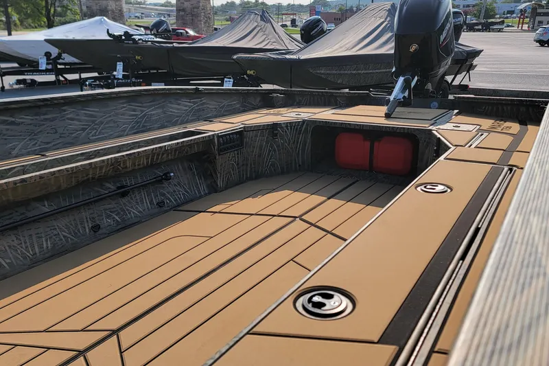 Slide: The Image of 2026 Tracker Grizzly 1756 T Marsh boat interior with camo design and spacious deck. - 4
