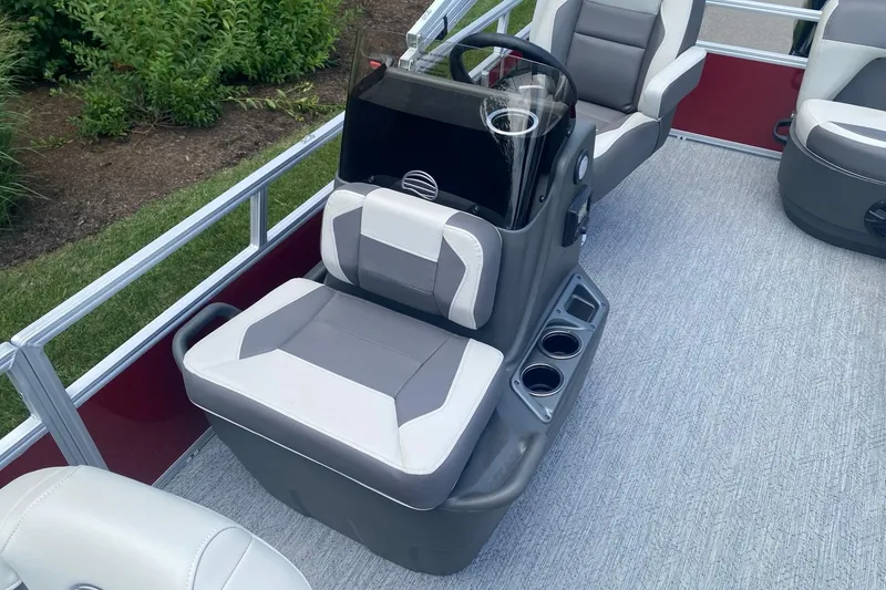 Slide: The Image of 2026 Sun Tracker Bass Buggy 16 XL Select interior with seating and steering console. - 4
