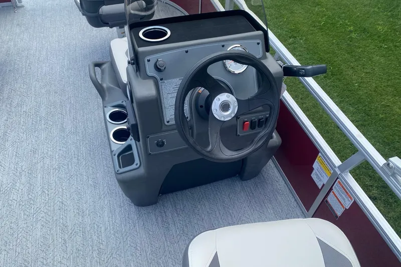 Slide: The Image of Steering console of 2026 Sun Tracker Bass Buggy 16 XL Select pontoon boat. - 7