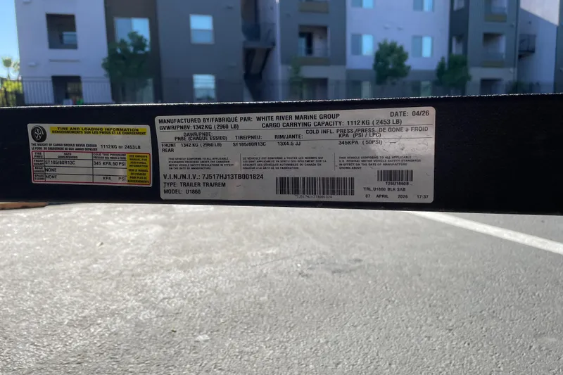 Slide: The Image of Label on 2026 Tracker Grizzly 1860 Utility trailer, showing specifications and manufacturing details. - 26