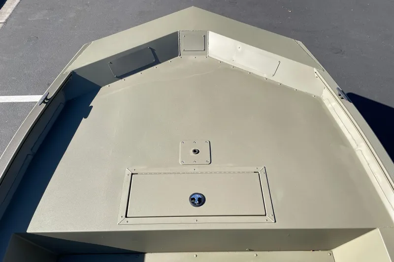 Slide: The Image of 2026 Tracker Grizzly 1860 Utility boat deck, featuring storage compartments. - 5