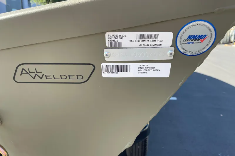 Slide: The Image of 2026 Tracker Grizzly 1860 Utility boat with all-welded construction and certification labels. - 25