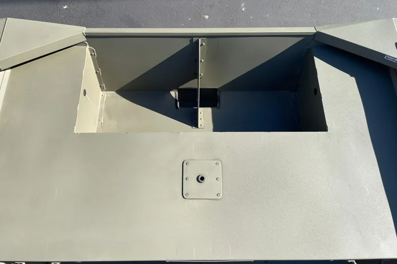 Slide: The Image of Tracker Grizzly 1860 Utility 2026 boat interior, showcasing storage compartments and durable construction. - 9