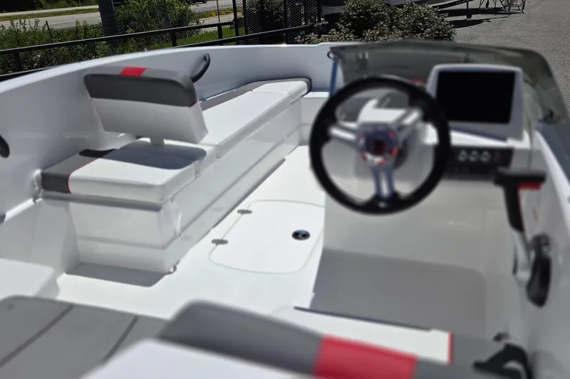 Slide: The Image of 2026 Tahoe T16 boat interior with modern steering and seating design. - 5