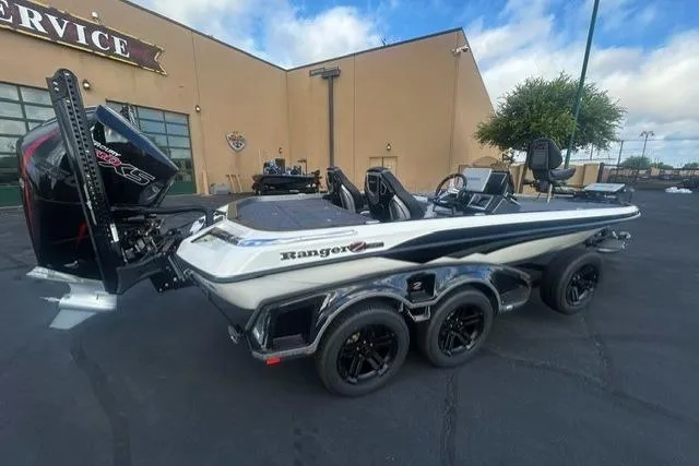 The Image of 2026 Ranger Z521R boat with trailer parked outside a service building. - 0