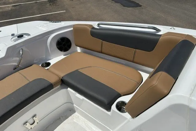 Slide: The Image of Interior seating of 2026 Tahoe 1950 boat with tan and black upholstery. - 19