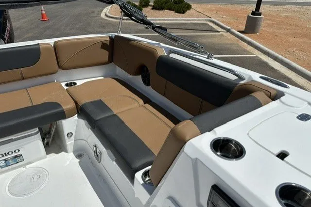 Slide: The Image of Interior of a 2026 Tahoe 1950 boat with tan and black seating. - 13