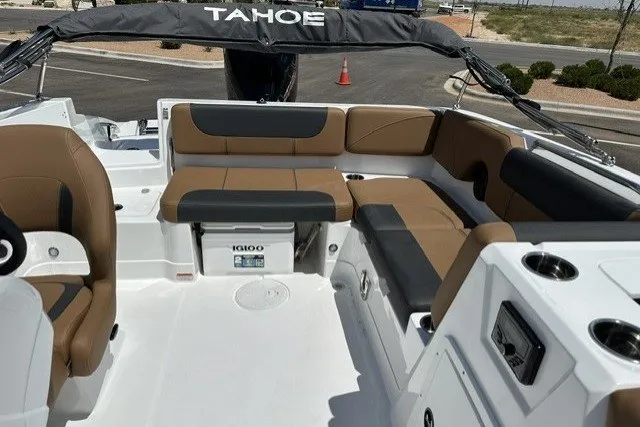 Slide: The Image of Interior of a 2026 Tahoe 1950 boat with tan and black seating. - 18