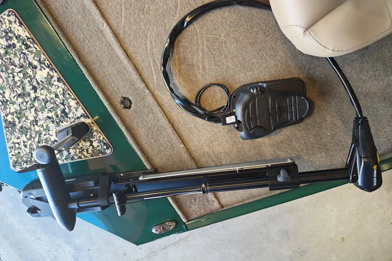 Slide: The Image of 2026 Tracker Bass Tracker Classic Limited boat interior with trolling motor and foot pedal. - 56