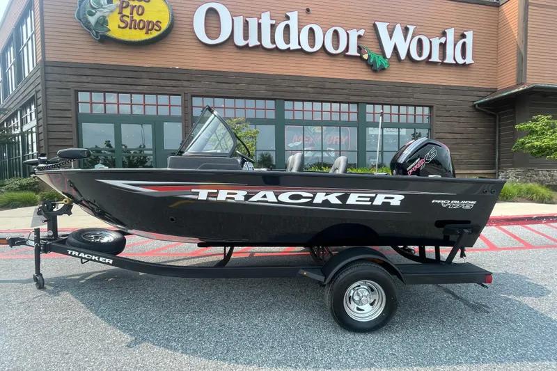 The Image of 2026 Tracker Pro Guide V-175 Combo boat displayed outside Outdoor World store. - 0