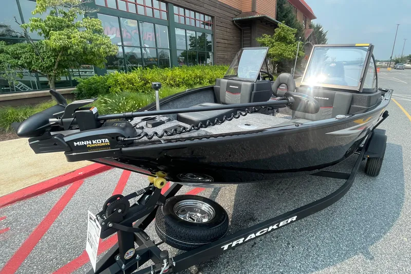Slide: The Image of 2026 Tracker Pro Guide V-175 Combo boat with Minn Kota PowerDrive motor on trailer. - 2