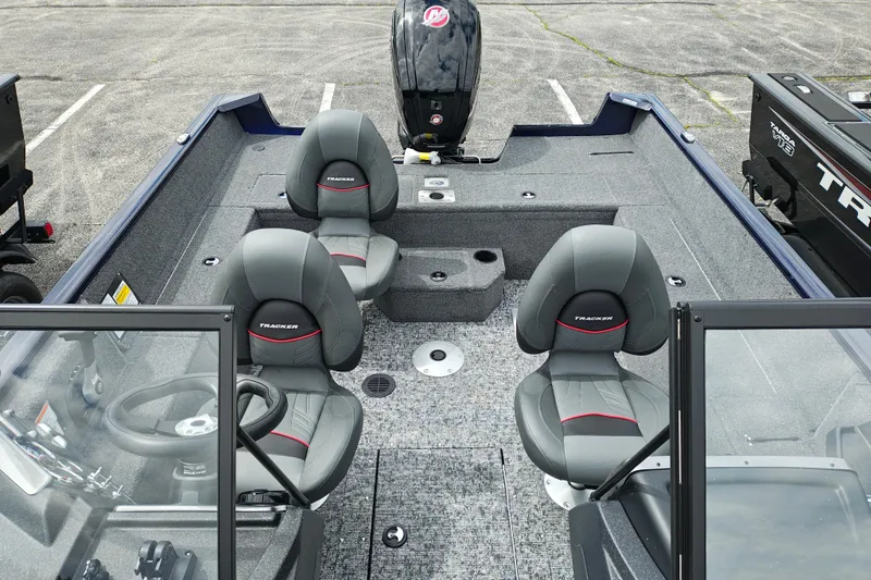 Slide: The Image of 2026 Tracker Pro Guide V-175 WT boat interior with gray seating and steering console. - 15