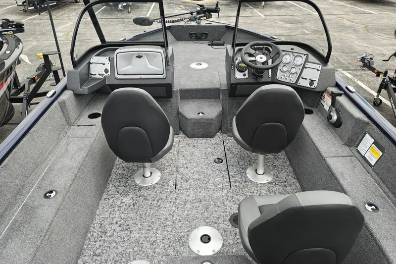 Slide: The Image of 2026 Tracker Pro Guide V-175 WT boat interior with dual seats and modern dashboard. - 5
