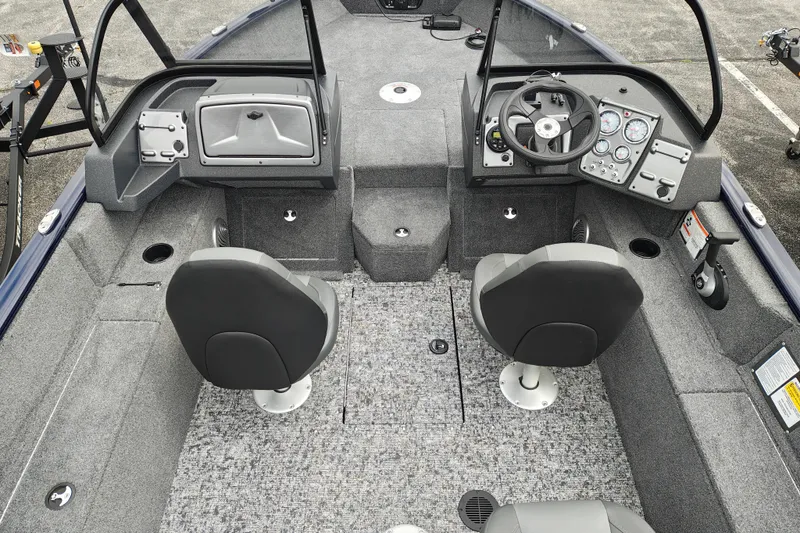 Slide: The Image of 2026 Tracker Pro Guide V-175 WT boat interior with dual seats and control panel. - 6