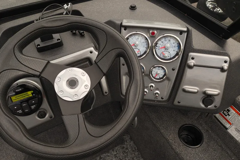 Slide: The Image of Steering wheel and dashboard of 2026 Tracker Pro Guide V-175 WT boat. - 9