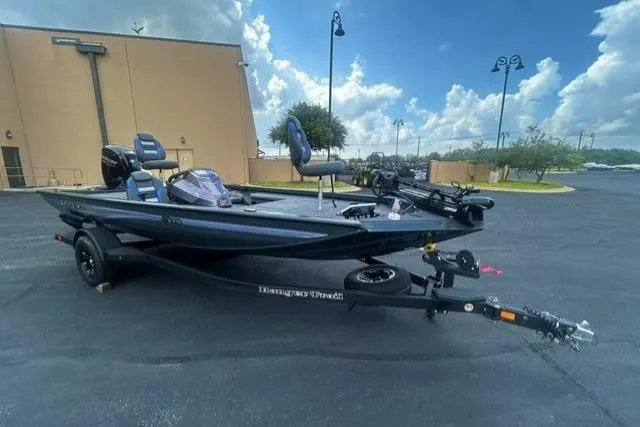The Image of 2026 Ranger RT178 boat parked outdoors under a cloudy sky. - 0