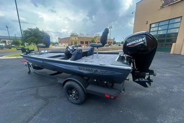 Slide: The Image of 2026 Ranger RT178 boat with Mercury engine parked outdoors. - 2