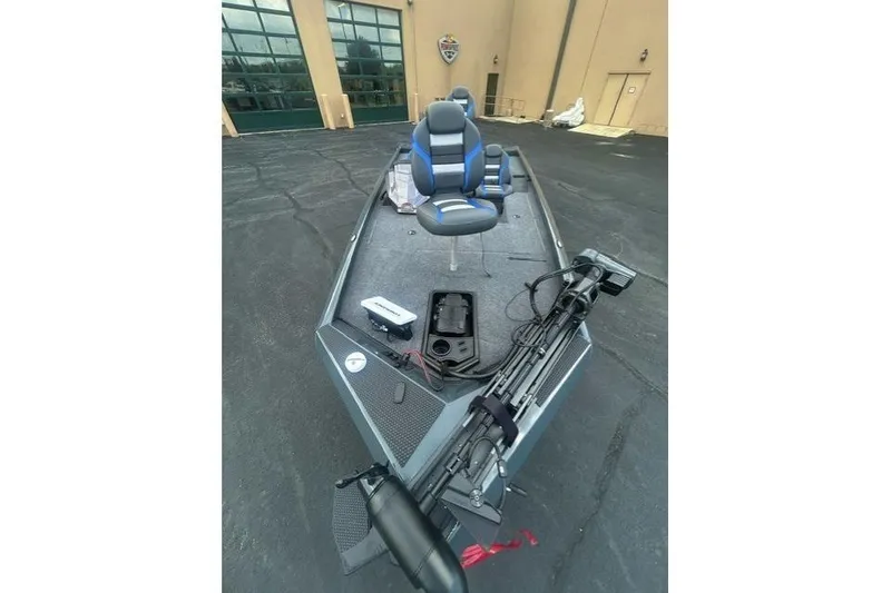 Slide: The Image of 2026 Ranger RT178 fishing boat with blue seats and equipment on deck. - 4